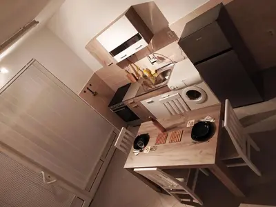 an overhead view of a small kitchen with a counter top at Apartman Todorovic in Jagodina