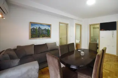 a living room with a couch and a table at Panoramske Vile in Vrnjačka Banja