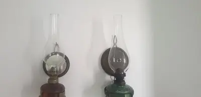 a pair of lamps hanging on a wall at Kutak- stan na dan in Paraćin