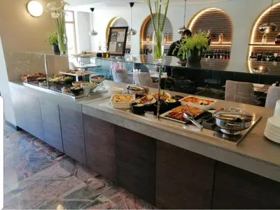 a buffet line with many different types of food at MONA RELAX in Vrnjačka Banja