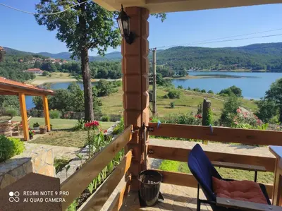 a view of a lake from the porch of a house at Vila Vera Borsko Jezero in Bor