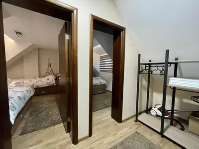 a bedroom with a bed and a bunk room at Casa Nostra Kop in Kopaonik