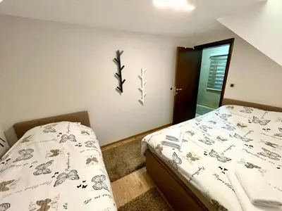 a bedroom with a bed in a room at Casa Nostra Kop in Kopaonik