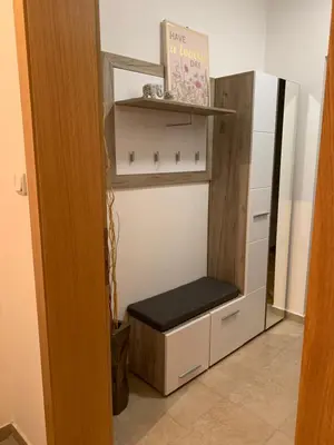 a room with a shelf with a bench in it at Apartman Gogić in Vrnjačka Banja
