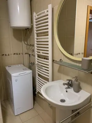 a bathroom with a sink and a mirror at Apartman Gogić in Vrnjačka Banja