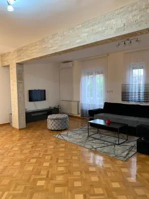 a living room with a couch and a tv at Apartman Gogić in Vrnjačka Banja
