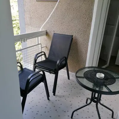 a patio with two chairs and a table and a table and chairs at Apartman Bogdanović Sokobanja in Soko Banja