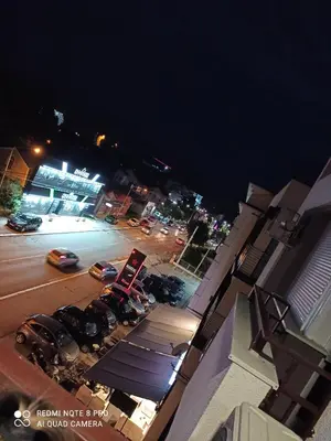an aerial view of a parking lot at night at Apartman NINA in Vrnjačka Banja
