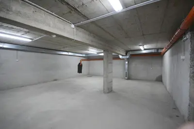 an empty parking lot in an empty parking garage at Apartman NINA in Vrnjačka Banja