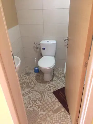 a small bathroom with a toilet and a tub at Studio BV in Vrnjačka Banja