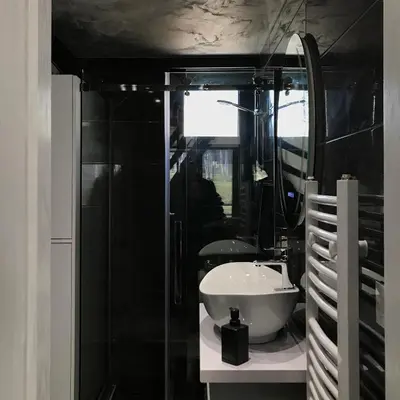 a bathroom with a white sink and a mirror at Miletic Villas in Despotovac