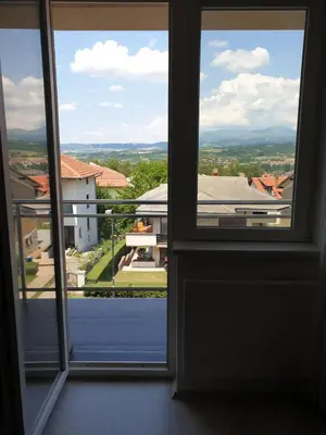 an open window with a view of a building at Sokolux in Soko Banja