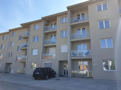 a building with a car parked in front of it at Sokolux in Soko Banja