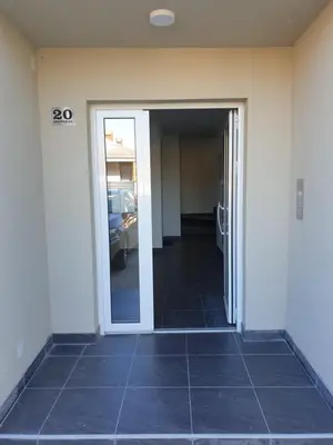 an open door to a hallway with a garage at Sokolux in Soko Banja
