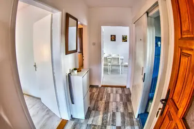 a hallway with a door leading to a dining room at Kuća Veneto & Free Parking in Soko Banja