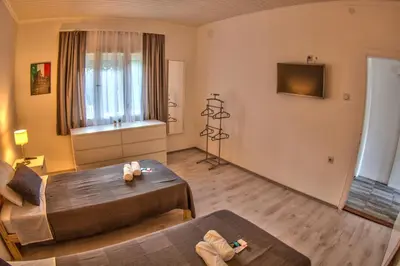 a living room with a bed and a couch at Kuća Veneto & Free Parking in Soko Banja
