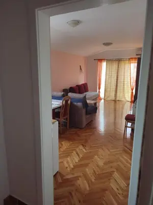a living room with a couch and a table at Smeštaj Ćirković in Vrnjačka Banja