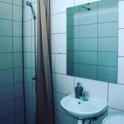 a bathroom with a sink and a mirror at Stari Zaječar apartments in Zaječar