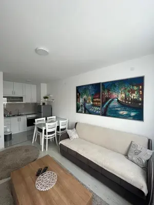 a living room with a couch and a table at The View Apartment in Soko Banja