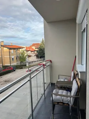 a balcony with a chair and a view of a street at The View Apartment in Soko Banja