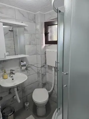 a bathroom with a toilet and a sink at Apartman Stefanovic in Vrnjačka Banja