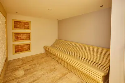 a bedroom with a bed and two pictures on the wall at A Hoteli - Hotel Park in Vrnjačka Banja