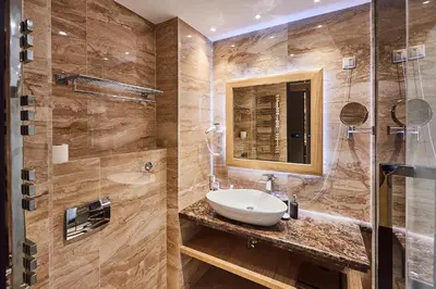 a bathroom with a sink and a shower at A Hoteli - Hotel Park in Vrnjačka Banja