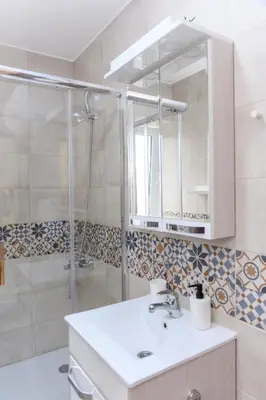 a bathroom with a sink and a shower at Panorama Lux in Soko Banja