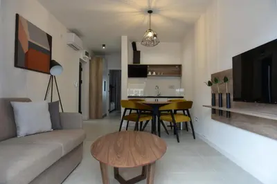 a living room with a couch and a table at 9 apartments in Jagodina