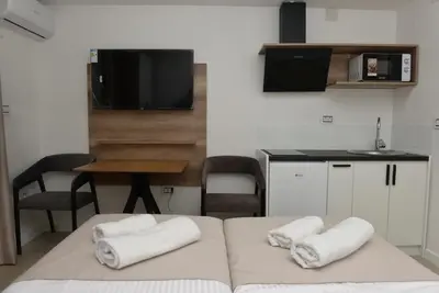 a room with two white towels on a bed at 9 apartments in Jagodina