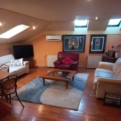 a living room with a couch and a coffee table at Loli Caffe Apartment in Prokuplje