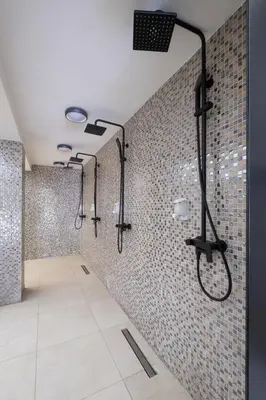 a bathroom with a shower with a shower head at Mila apartmani Kopaonik in Kopaonik