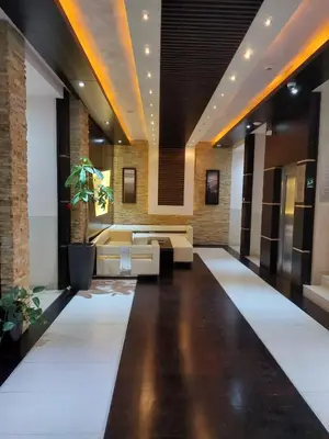 a living room with a couch and a table at Mila apartmani Kopaonik in Kopaonik