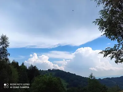 a view of a mountain with clouds in the sky at Vikendica Kop in Kopaonik