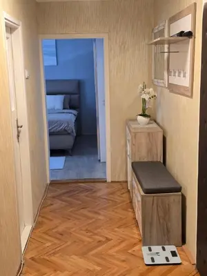 a room with a bedroom with a bed and a scale at Kingston in Pirot
