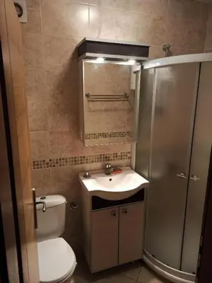 a bathroom with a toilet and a sink and a shower at Apartment Park in Vrnjačka Banja