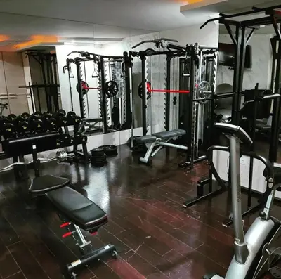 a gym with lots of equipment in a room at Apartman ZoneS - Zoned in Kopaonik