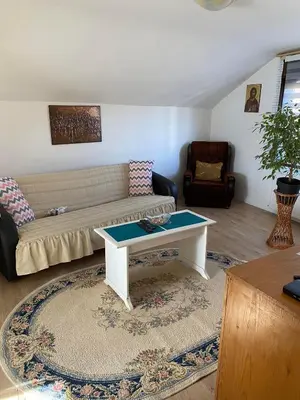 a living room with a couch and a coffee table at Mićin dom in Pirot