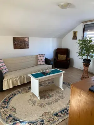 a living room with a couch and a table at Mićin dom in Pirot