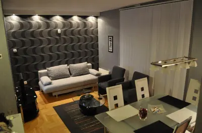a living room with a couch and a table at Lux apartment A38, Kraljevi čardaci, Kopaonik in Kopaonik