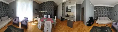 a living room with purple chairs and a table at Lux apartment A38, Kraljevi čardaci, Kopaonik in Kopaonik