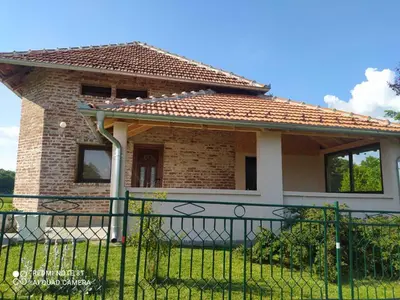 a small house with a fence in front of it at Vikendica Matić in Goč