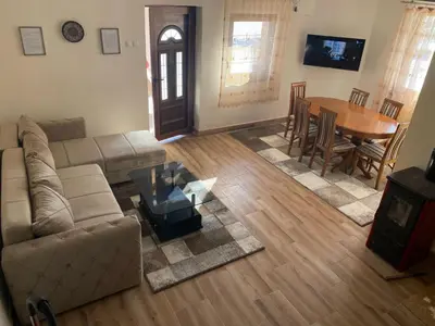 a living room with a couch and a table at Vikendica Matić in Goč