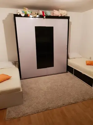 a mirror in a room with two beds at FARAON pn 3 in Paraćin