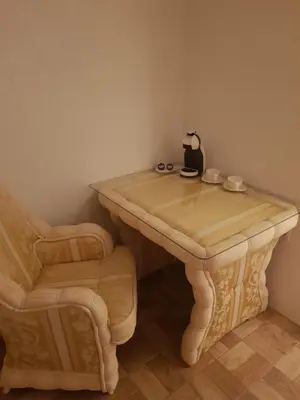 a table and a chair in a room at FARAON pn 3 in Paraćin
