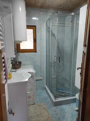 a bathroom with a shower and a sink at Vikendica Darija in Kraljevo