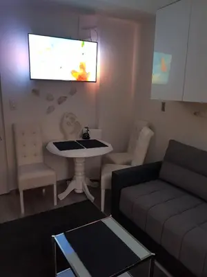 a living room with a couch and a table at FARAON pn 1 in Paraćin