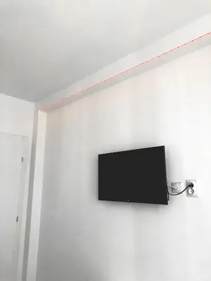 a flat screen tv hanging on a wall at Apartman DEA in Soko Banja