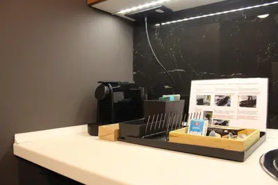 a white counter with a box on top of it at Elite Space in Niš