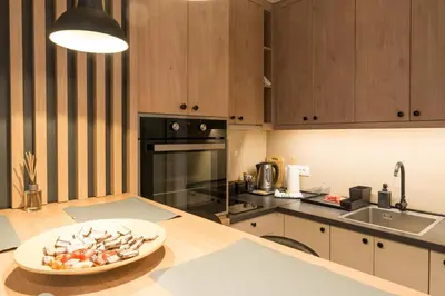 a kitchen with a plate of food on a counter at Apartman Sandra Free parkig in Vrnjačka Banja